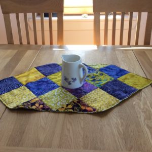 purple and yellow batik table runner